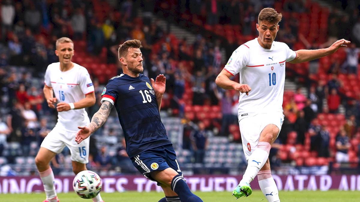 Liam Cooper (Scotland) and Patrik Schick (Czechia) who fires a shot