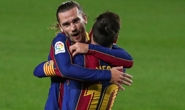 Antoine Griezmann et Lionel Messi exultent.